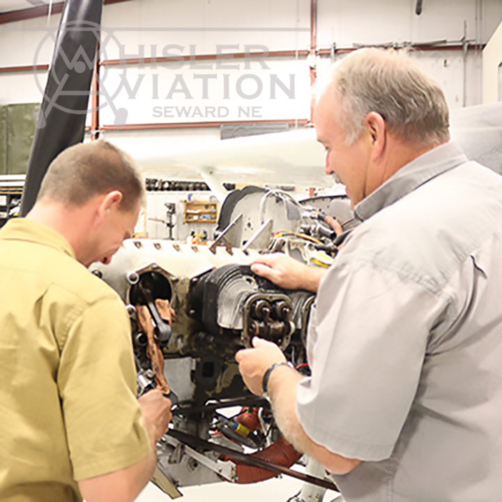 Jon & Greg working on a small aircraft engine at Whisler Aviation in Seward Nebraska